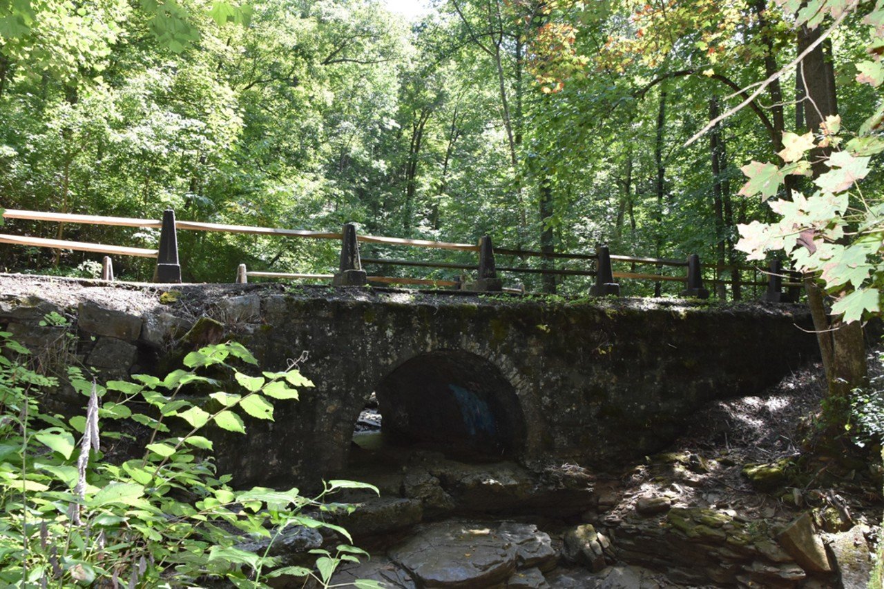 Bridges To The Past
Louisville Nashville Turnpike, West Point, KY
Bridges to the Past is a 2.4-mile, out-and-back, paved trail. The trail follows the old L & N Turnpike, which was chartered in 1837 and in use until 1919. Along the trail are three stone bridges that are over 150 years old (hence the name of the trail). Sieboldt Cave is also visible from the trail, but you are not allowed to approach the caves.