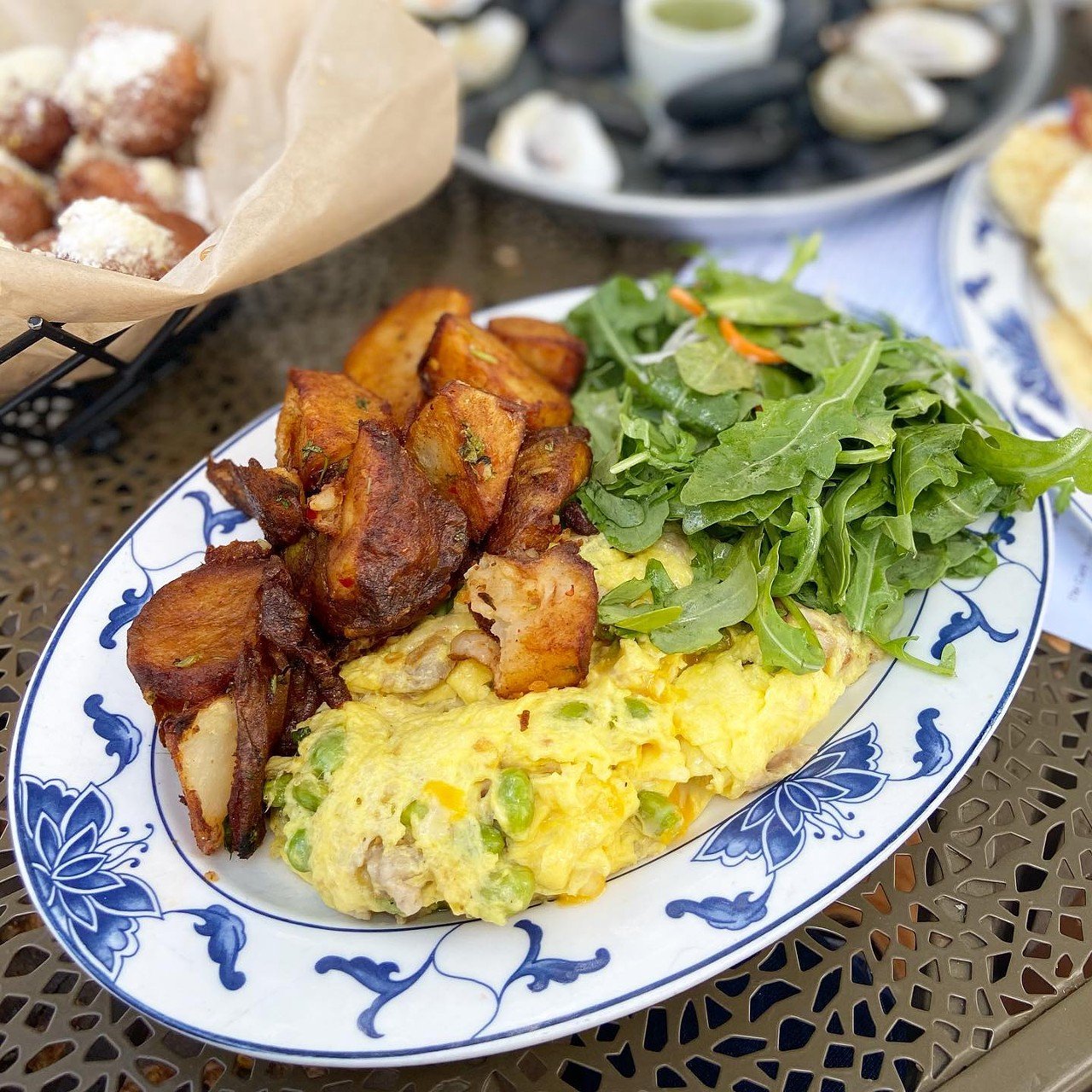 Chik'n & Mi
1765 Mellwood Ave.
Chik&#146;n & Mi continues to evolve, with a delicious brunch that offers that Asian inspired comfort food that you love.
Featured in the photo is The Scrambled &#150; scrambled eggs with pork belly and edamame. Calabrese potatoes and arugula salad.
