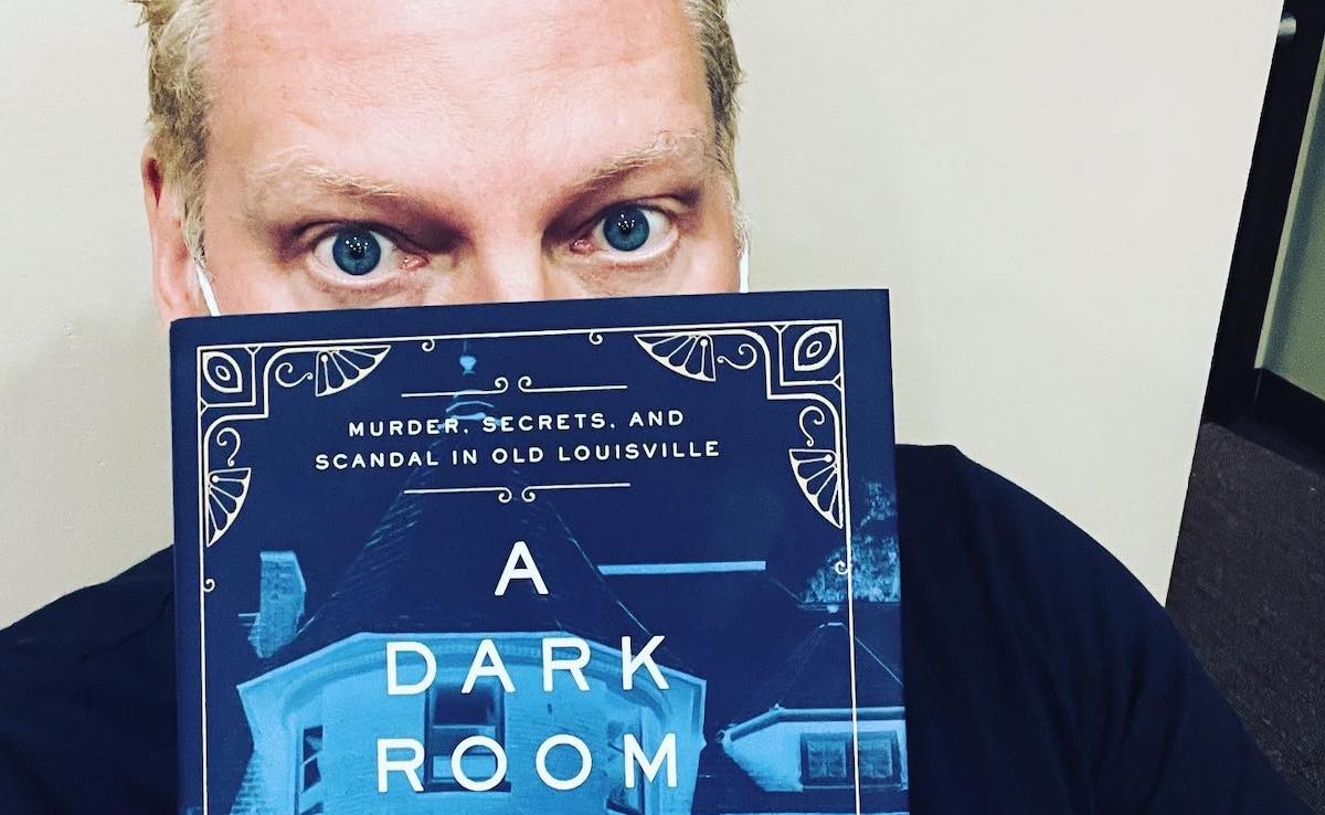 David Domin&eacute; with his book, "A Dark Room in Glitter Ball City."  |  Photo courtesy of David Domin&eacute;