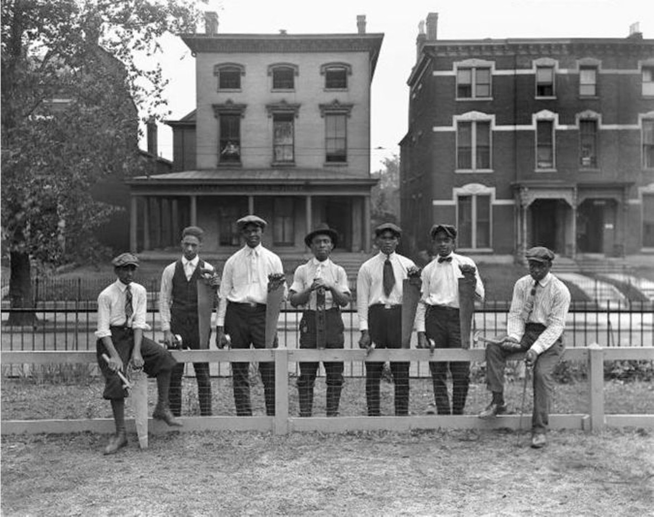 1920 - 7 young men build Prentice School fence, 316 W. Chestnut Street. University of Louisville Photographic Archives