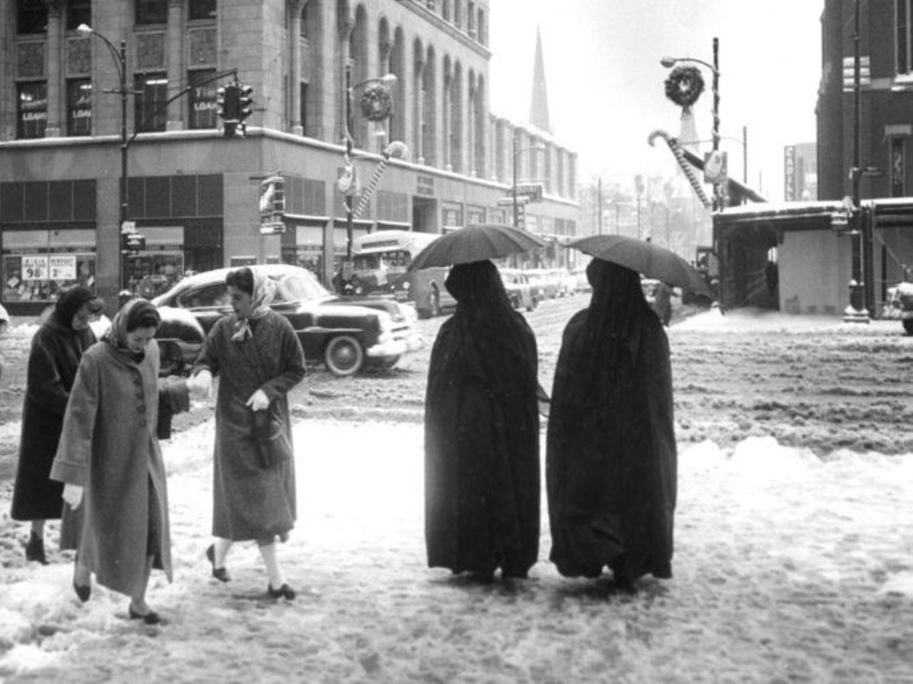 1940s - 4th & Broadway, looking south. Muslim women in religious dress. University of Louisville Photographic Archives