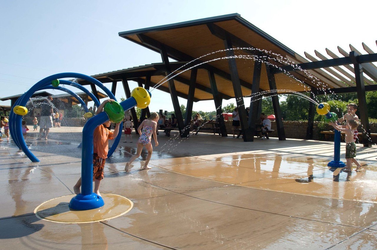 The Parklands at Floyd Fork
Broad Run Park: 11551 Bardstown Rd & Beckley Creek Park: 1411 Beckley Creek Pkwy
The Parklands at Floyd Fork have two locations where your little ones (or you!) can splash and get out of the heat for a while. Water cannons and a three-loop spray tunnel can be fun for all ages. No admission fee required.