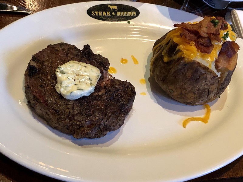 How many miles do you have to run to work off Steak & Bourbon's Angus steak that weighs almost a pound with a loaded baked potato full of sour cream and bacon on the side? Don't ask! - Robin Garr