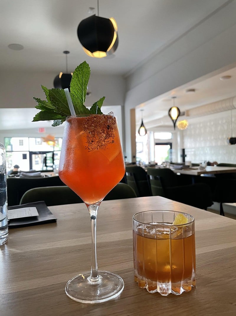 Enso’s creative cocktails add a distinct Japanese flavor to your drink. Here, a watermelon-scented porch spritz (left) with leafy shiso garnish; and an Enso Old Fashioned made with Toki Japanese whisky,. - Robin Garr