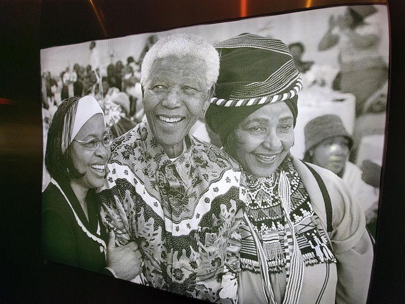 This photo shows Nelson Mandela (center) and wife Winnie (right). Mandela served as the 1st President of South Africa from 1994 – 1999, after many years of intense protests and sanctions placed against the Dutch administrations. - rucker