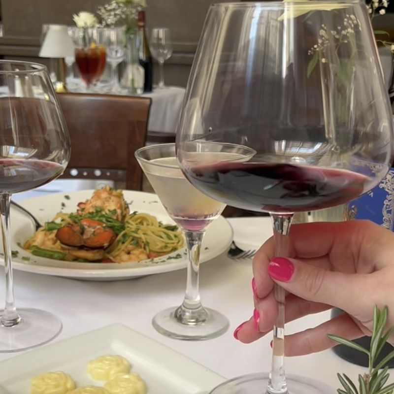 Elegant white tablecloths and fine, thin-stemmed wine glasses with oversize bowls enhance the experience, and the price, at Vincenzo's. - Robin Garr